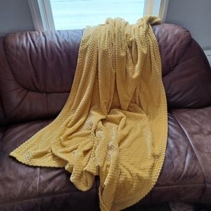 Yellow throw blanket